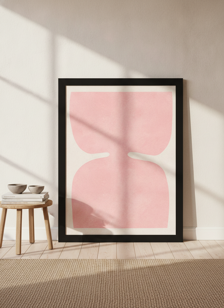 Oversized statement modern wall art print leaning against the wall in a warm Japandi living room