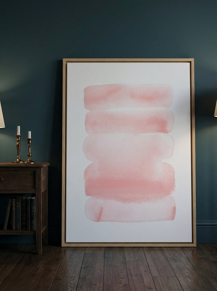 Oversized statement canvas wall art with a natural timber surround leaning against the wall in a moody living room