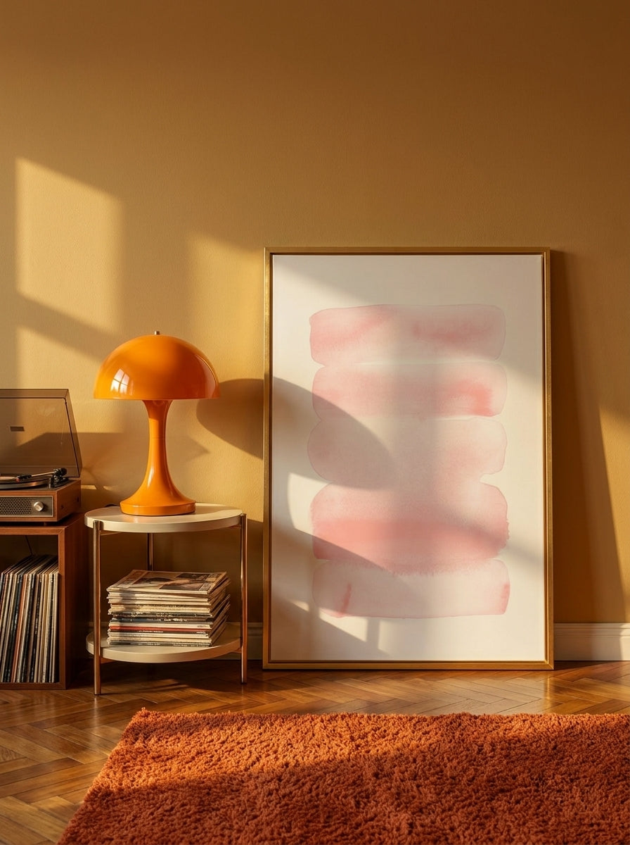 Canvas wall art with a gold leaf surround leaning against the wall in a retro 70s bedroom