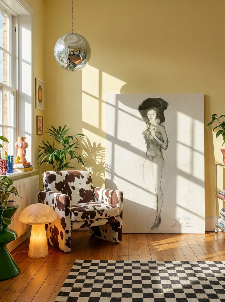Stretched canvas wall art leaning against the wall in a colourful eclectic home office