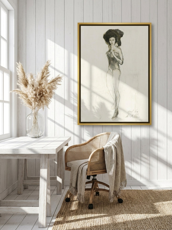 Canvas wall art with a gold leaf surround styled on the wall in a coastal home office