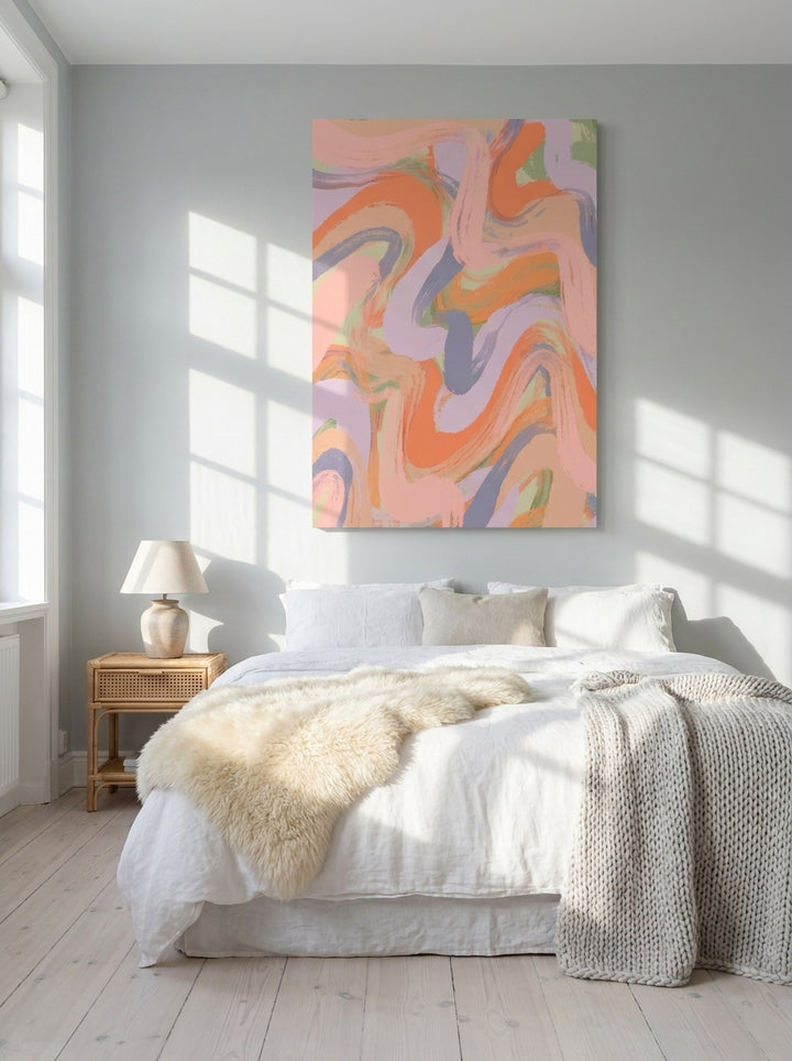 Stretched canvas wall art styled on the wall in a bright Scandinavian bedroom