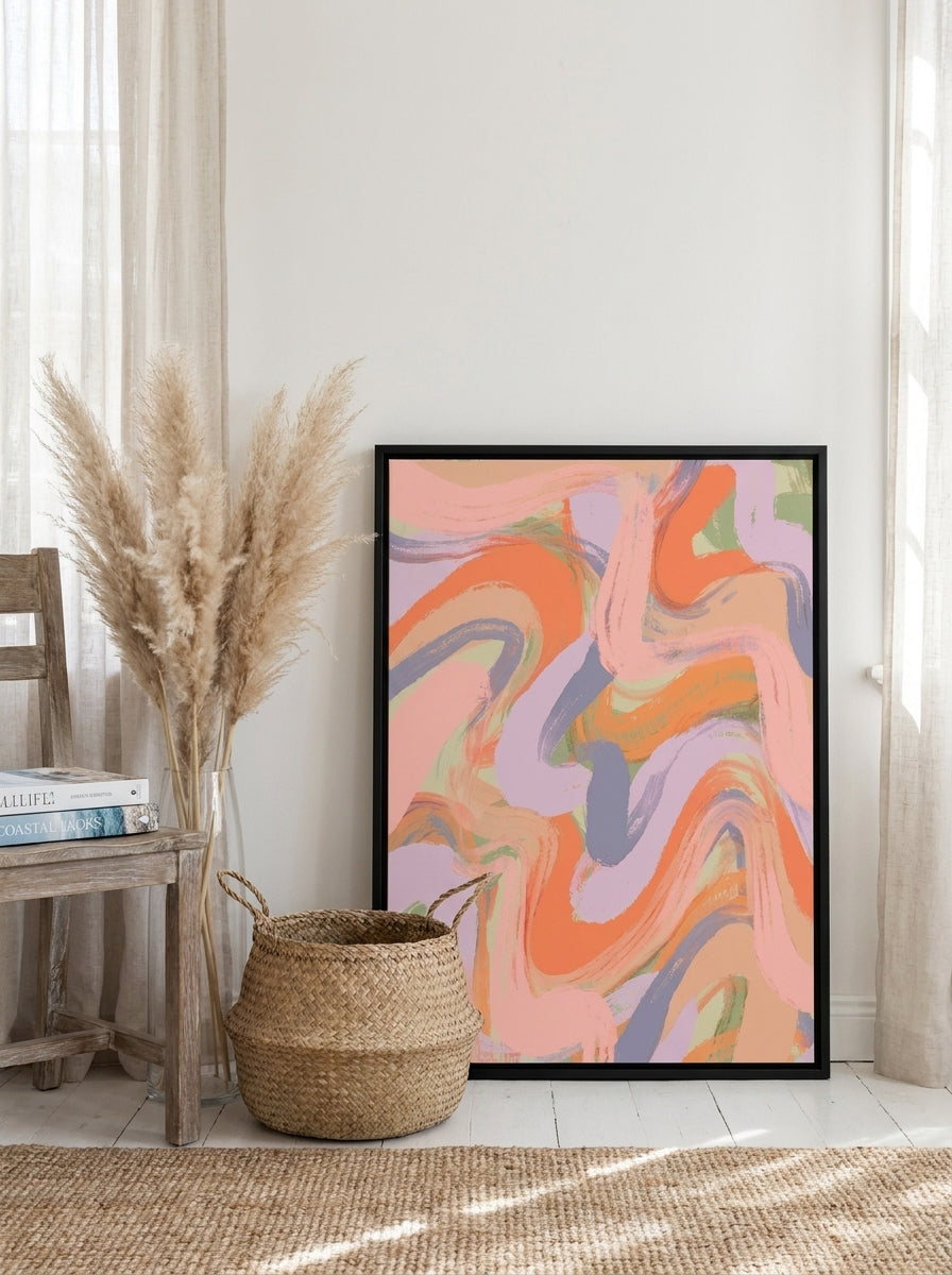 Canvas wall art with a black surround leaning against the wall in a coastal home office