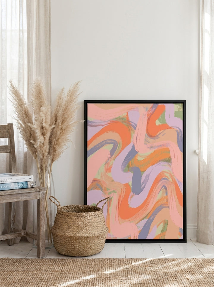 Canvas wall art with a black surround leaning against the wall in a coastal home office