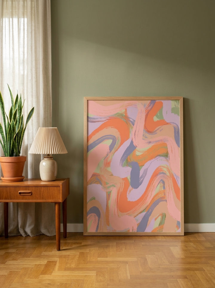 Modern wall art print leaning against the wall in a mid-century home office