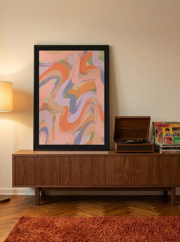 Modern wall art print standing on a sideboard in a retro 70s bedroom