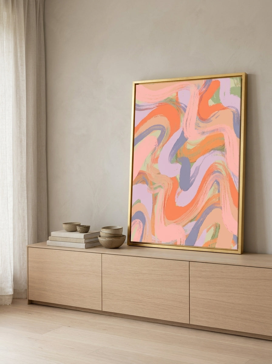 Canvas wall art with a gold leaf surround standing on a sideboard in a warm Japandi living room
