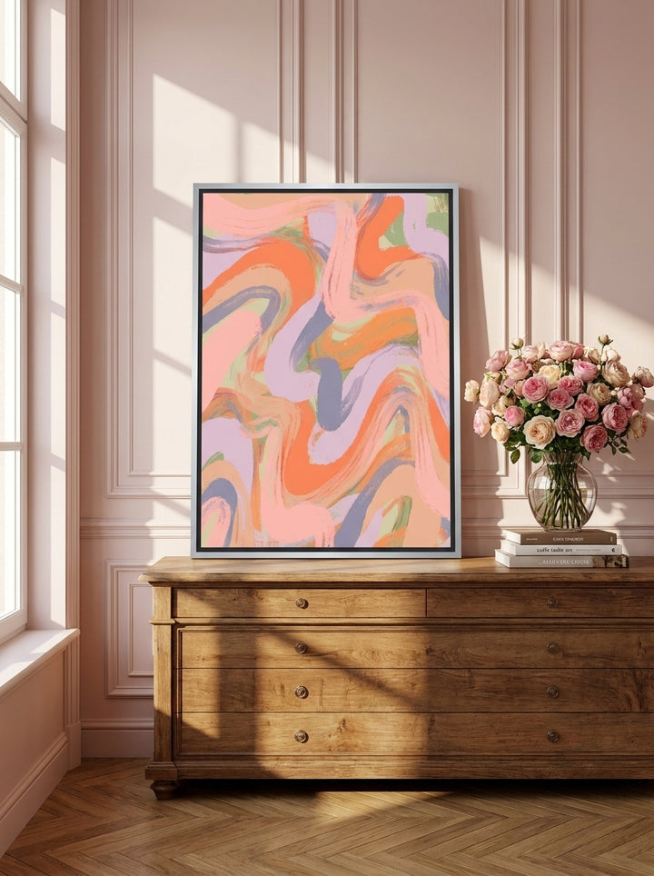 Canvas wall art with a silver leaf surround standing on a sideboard in a Parisian bedroom