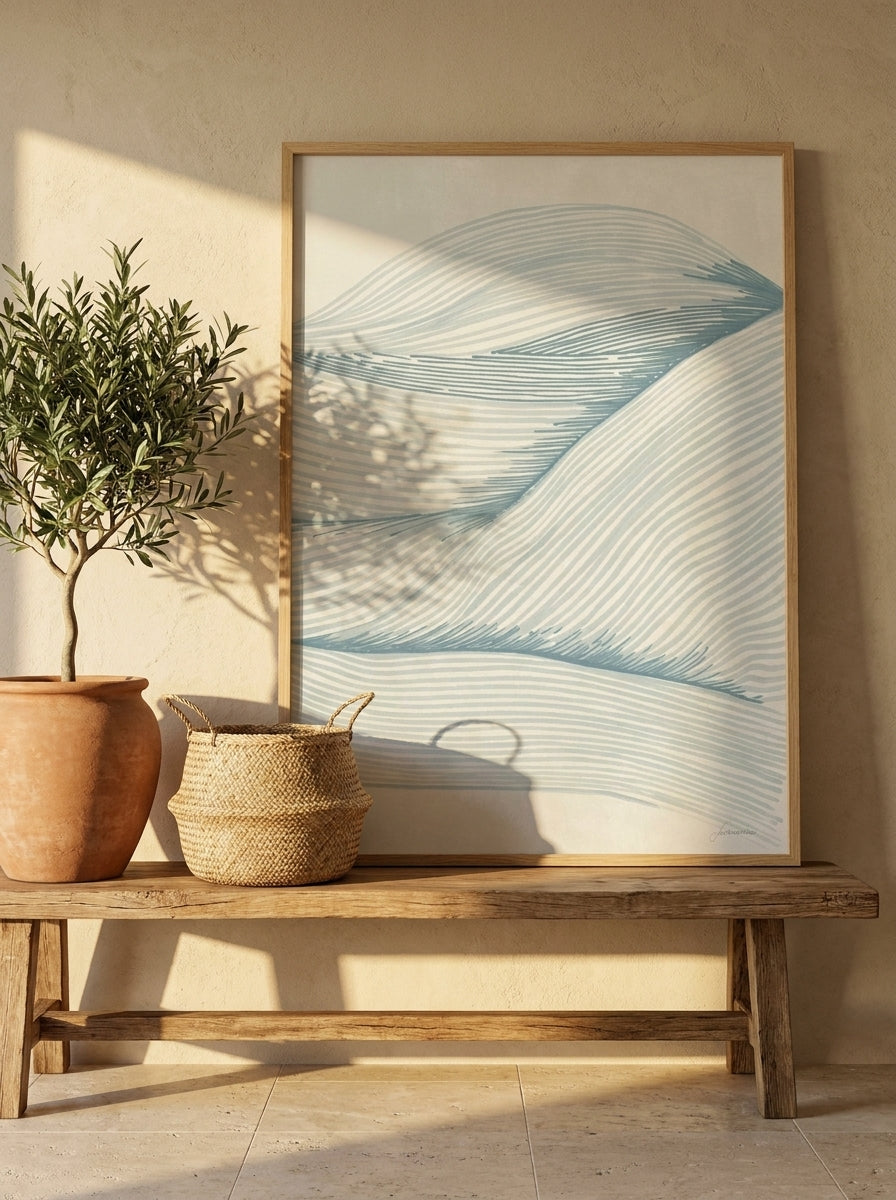 Modern wall art print standing on a bench in a Mediterranean bathroom