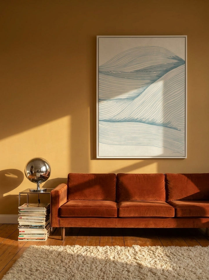 Oversized statement canvas wall art with a white surround styled on the wall in a retro 70s living room