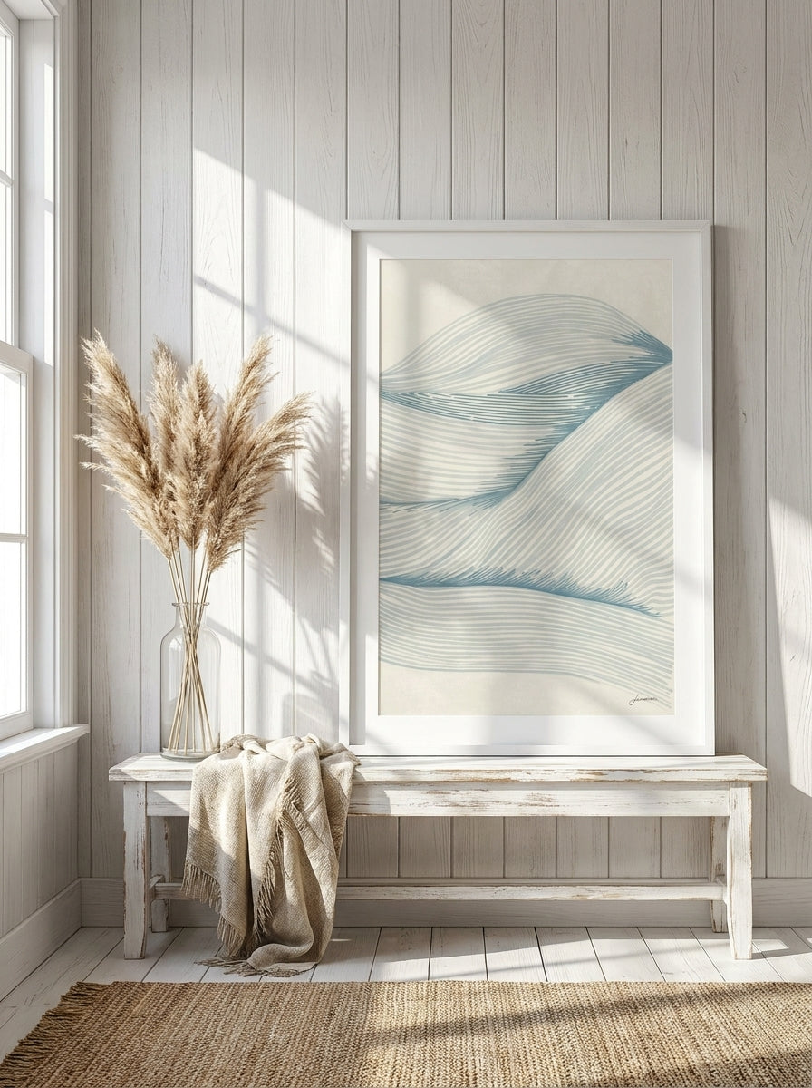 Modern wall art print standing on a console in a coastal home office