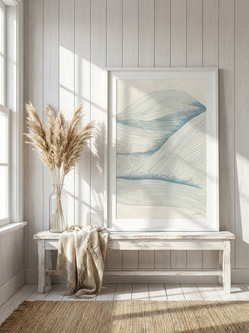 Modern wall art print standing on a console in a coastal home office