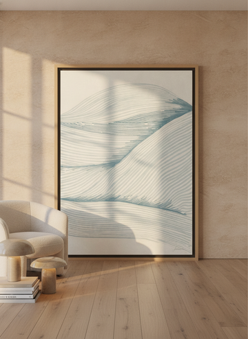 Oversized statement canvas wall art with a natural timber surround leaning against the wall in a luxe bathroom