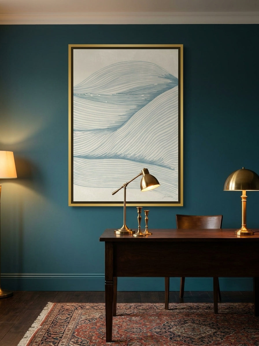Canvas wall art with a gold leaf surround styled on the wall in a moody home office