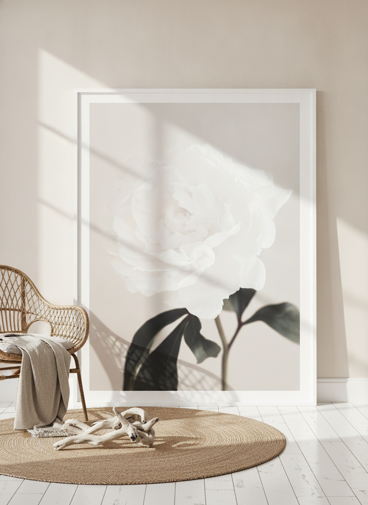 Oversized statement modern wall art print leaning against the wall in a coastal living room