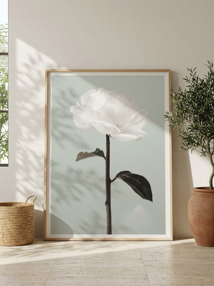 Oversized statement modern wall art print leaning against the wall in a Mediterranean dining room