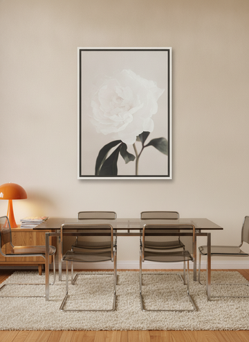 Canvas wall art with a white surround styled on the wall in a retro 70s dining room