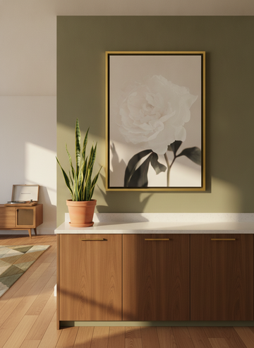Oversized statement canvas wall art with a gold leaf surround styled on the wall in a mid-century kitchen