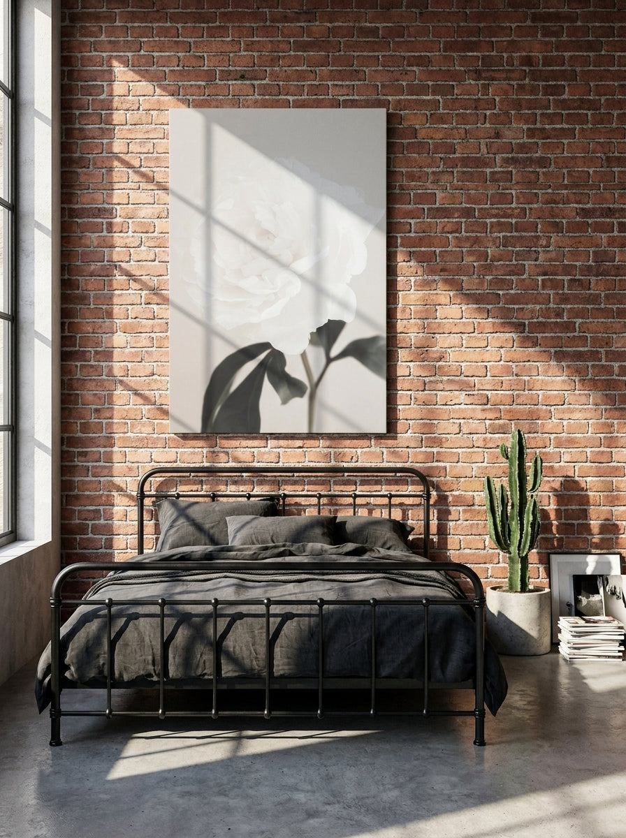 Stretched canvas wall art styled on the wall in an industrial loft bedroom