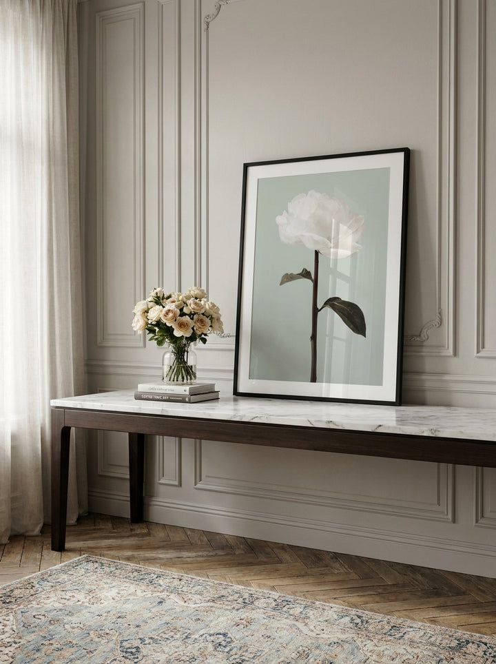 Modern wall art print standing on a console in a Parisian home office
