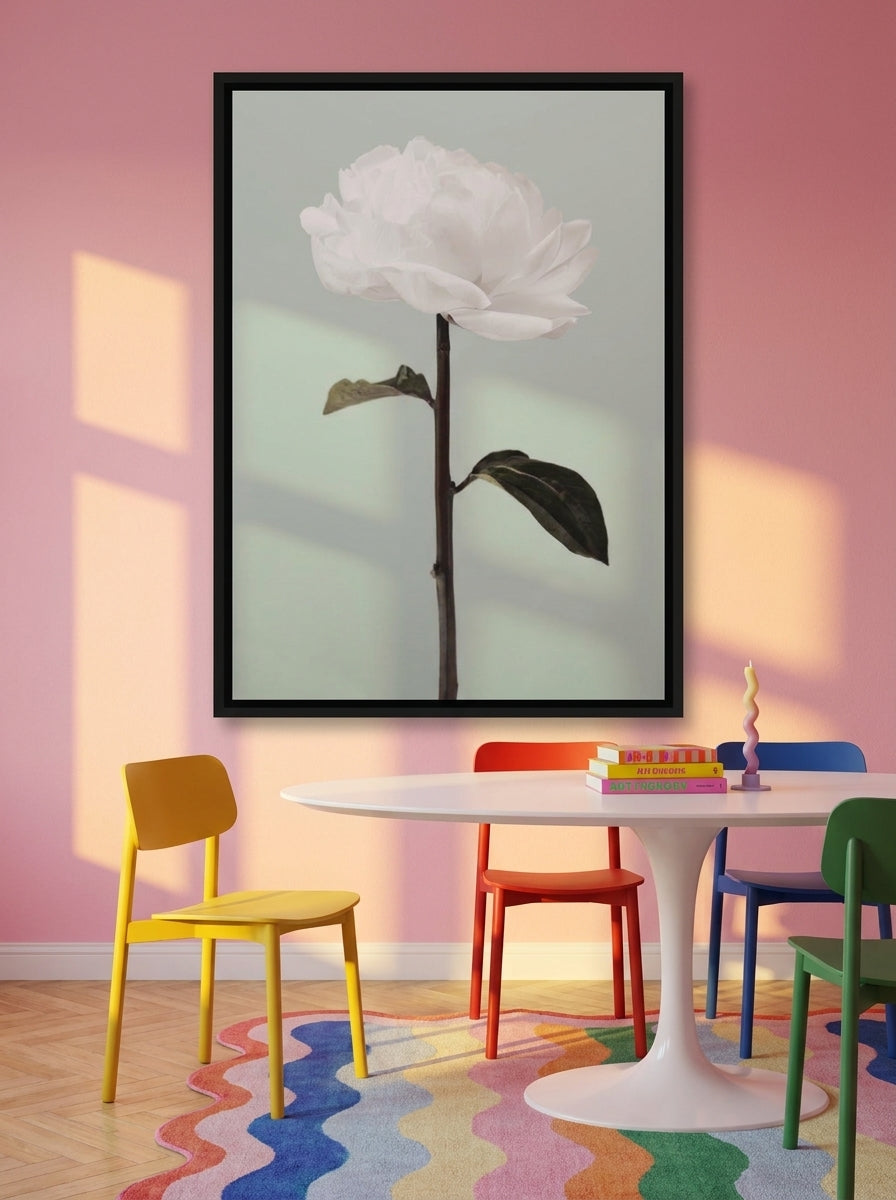 Oversized statement canvas wall art with a black surround styled on the wall in a colourful eclectic dining room