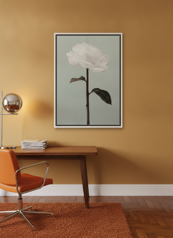 Canvas wall art with a white surround styled on the wall in a retro 70s home office