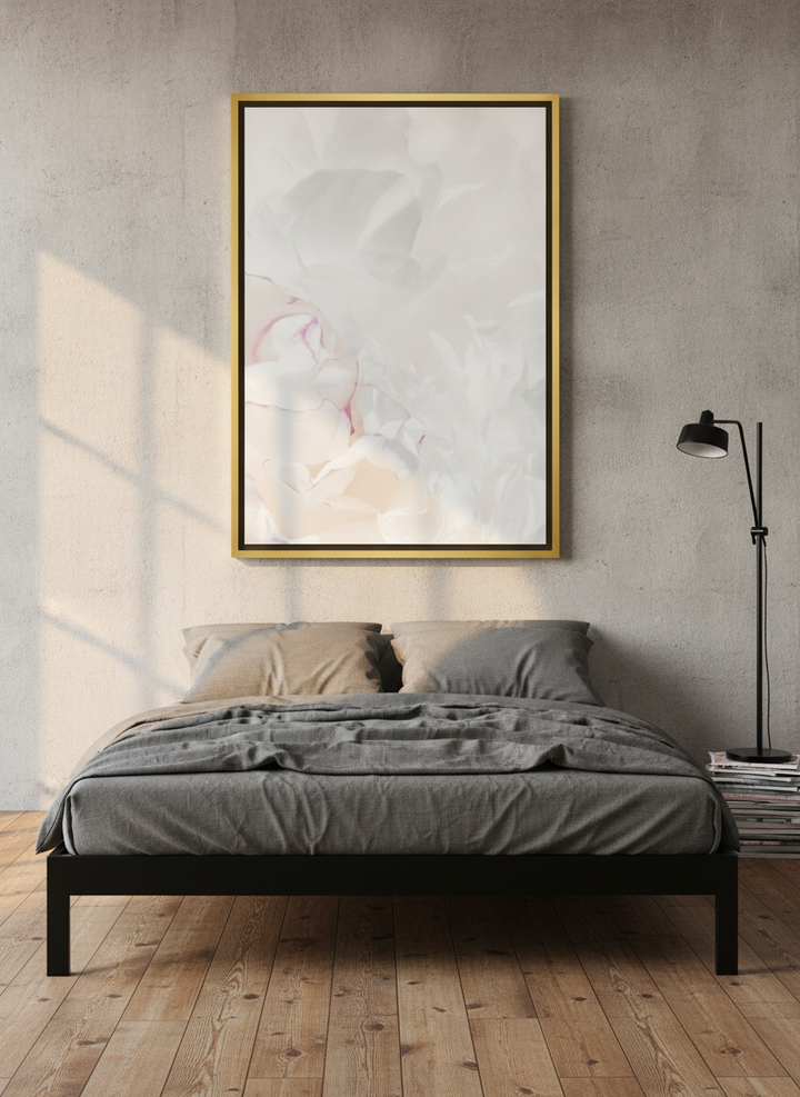 Canvas wall art with a gold leaf surround styled on the wall in an industrial loft bedroom