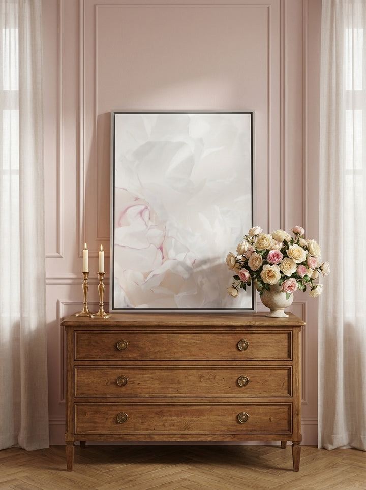 Canvas wall art with a silver leaf surround standing on a sideboard in a Parisian bathroom