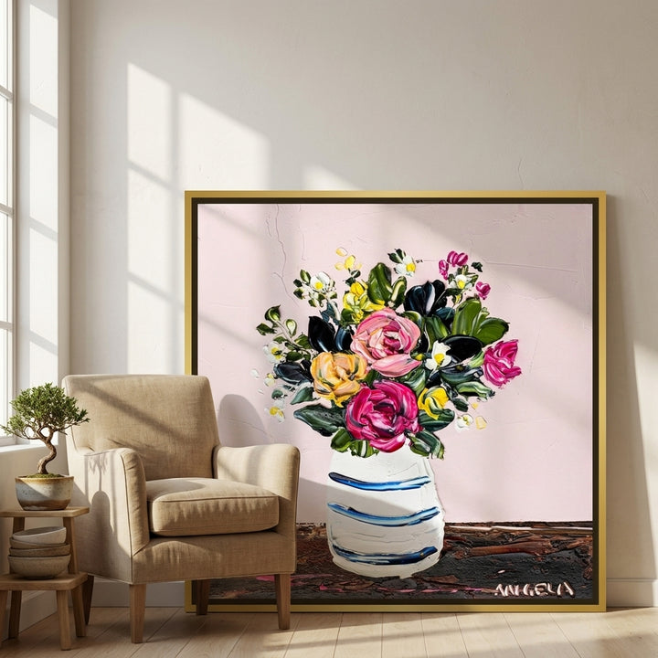Canvas wall art with a gold leaf surround leaning against the wall in a warm Japandi bathroom