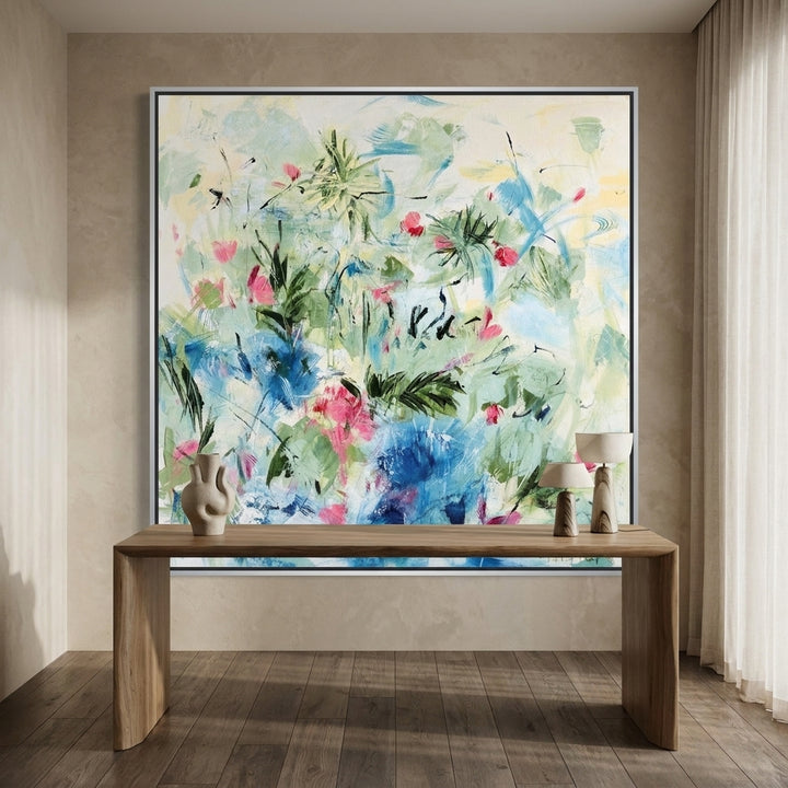 Canvas wall art with a silver leaf surround styled on the wall in a luxe home office