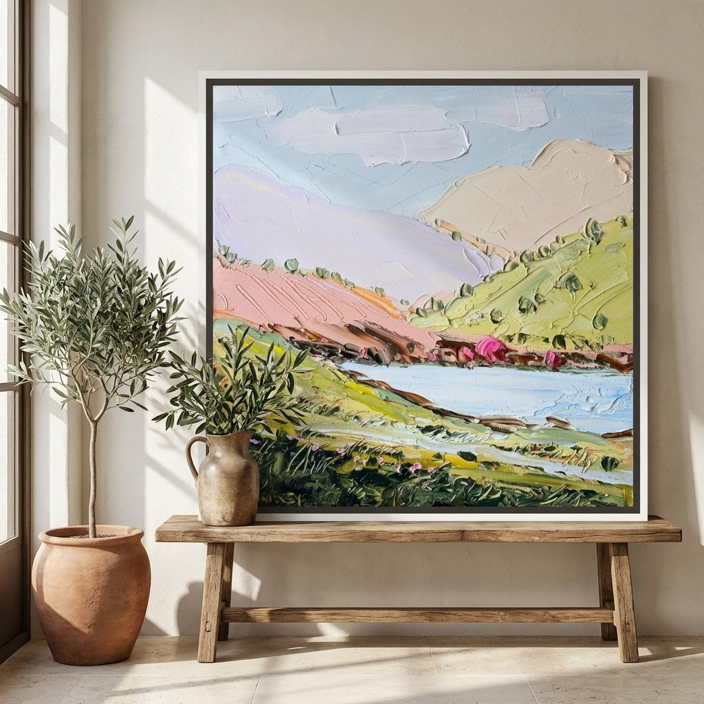 Canvas wall art with a white surround standing on a bench in a Mediterranean home office