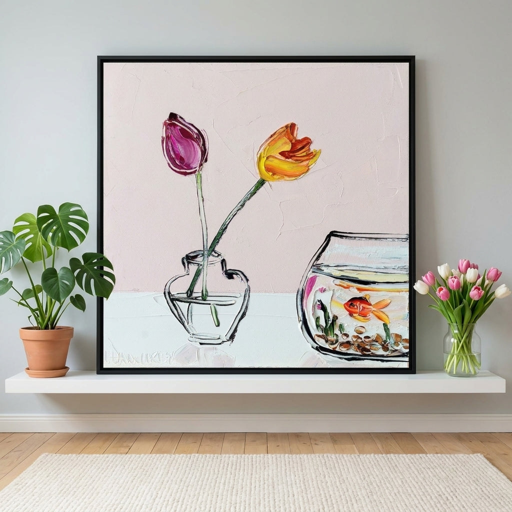 Canvas wall art with a black surround standing on a shelf in a bright Scandinavian living room