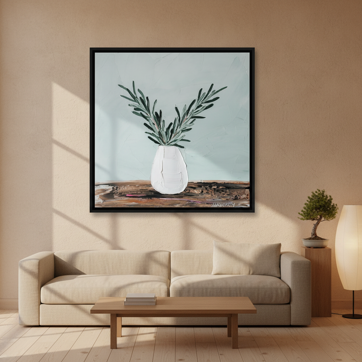 Oversized statement canvas wall art with a black surround styled on the wall in a warm Japandi living room