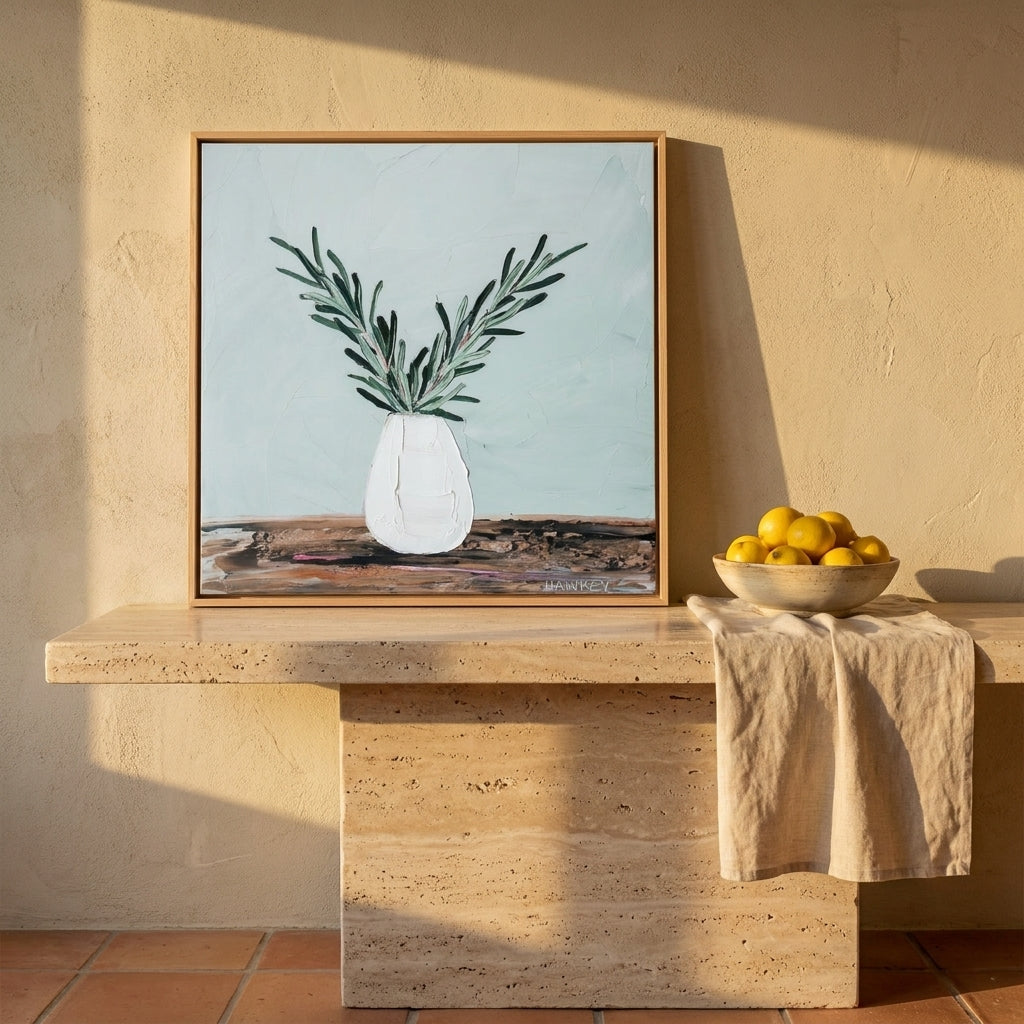 Canvas wall art with a natural timber surround standing on a kitchen bench in a Mediterranean kitchen