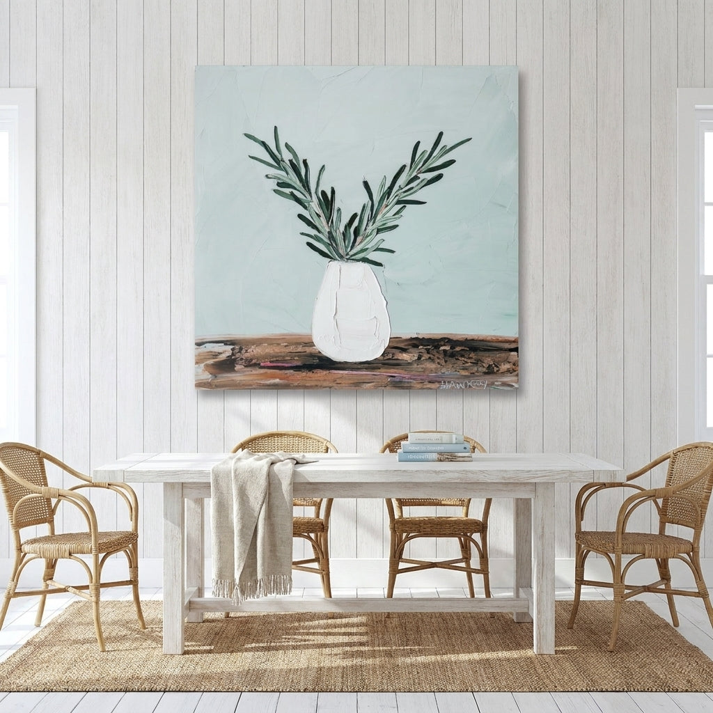 Stretched canvas wall art styled on the wall in a coastal dining room