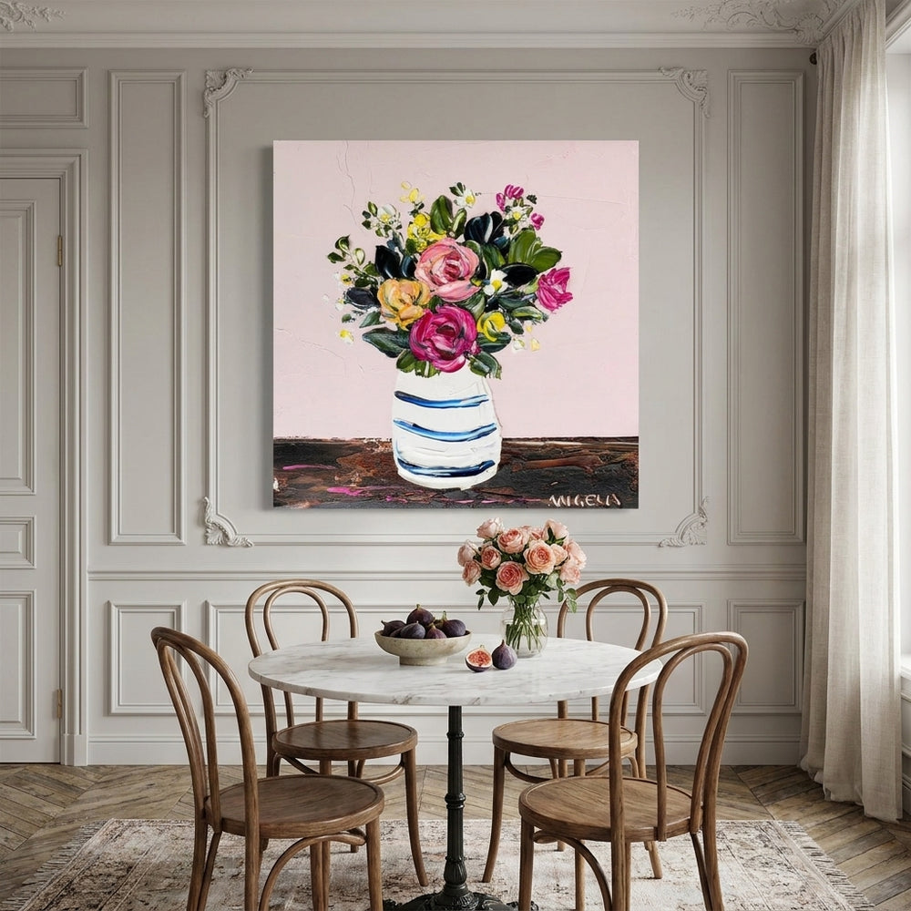 Stretched canvas wall art styled on the wall in a Parisian dining room