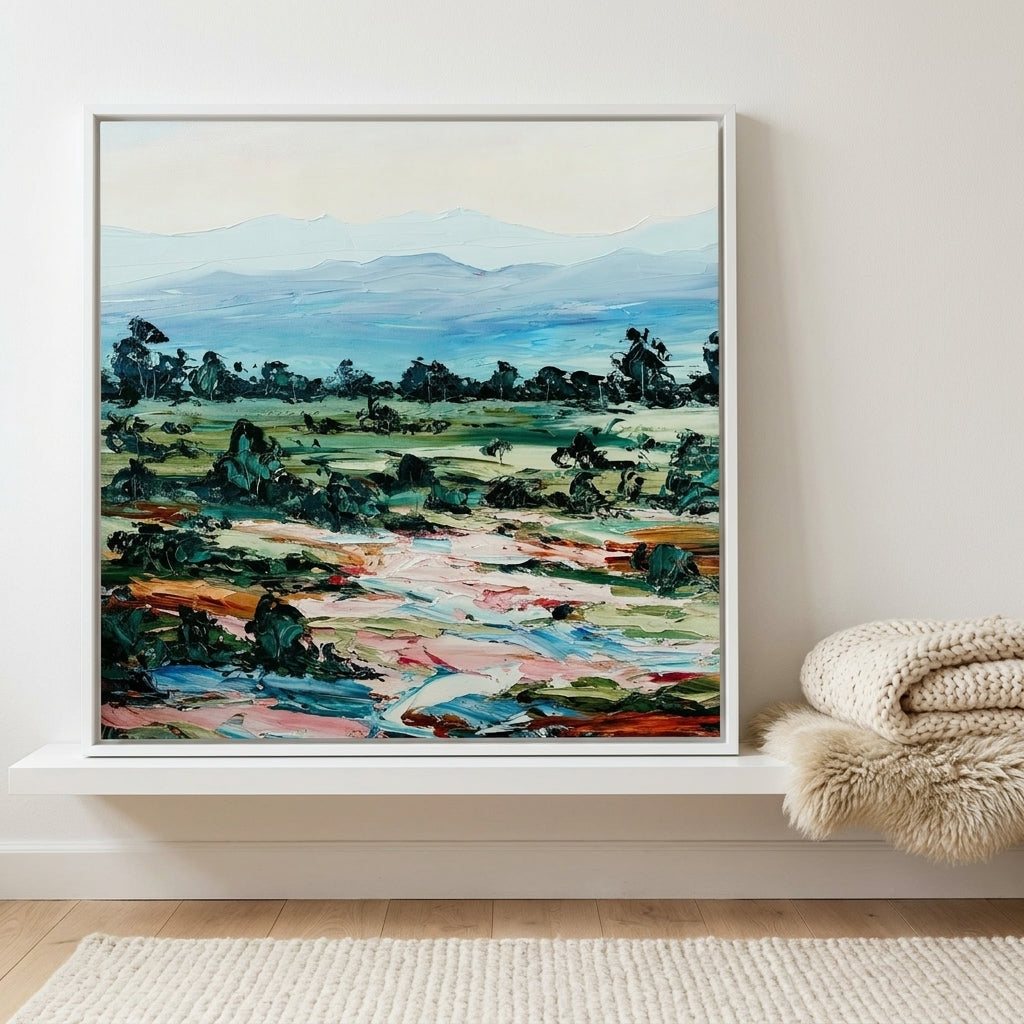 Canvas wall art with a white surround standing on a shelf in a bright Scandinavian bedroom