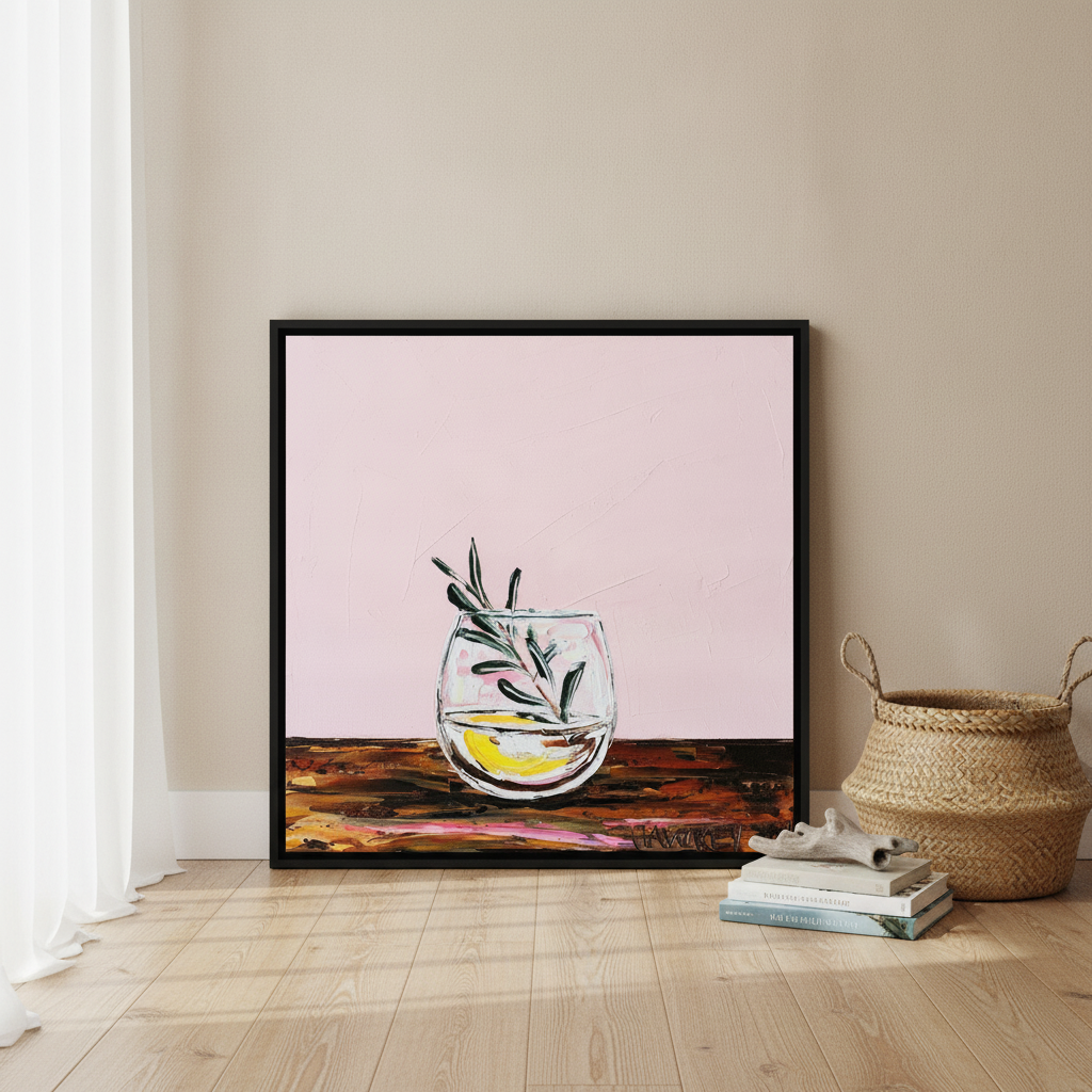 Canvas wall art with a black surround leaning against the wall in a coastal living room