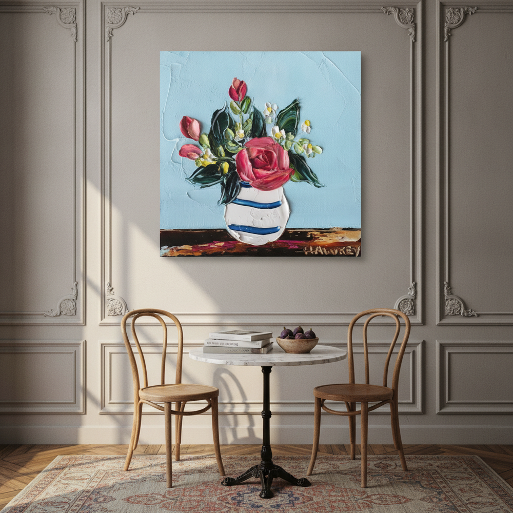 Stretched canvas wall art styled on the wall in a Parisian dining room
