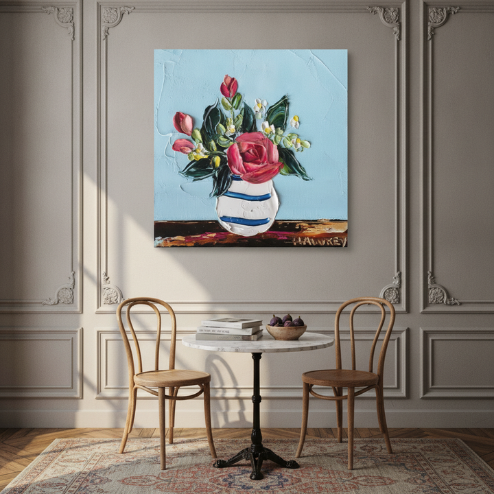 Stretched canvas wall art styled on the wall in a Parisian dining room
