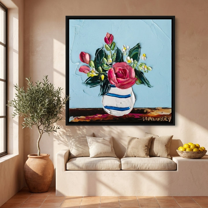 Oversized statement canvas wall art with a black surround styled on the wall in a Mediterranean living room