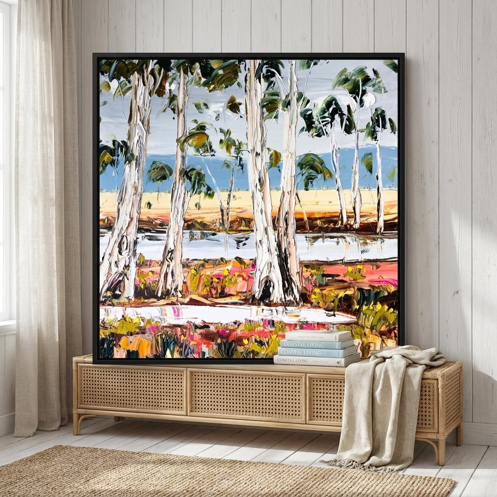 Canvas wall art with a black surround standing on a sideboard in a coastal home office
