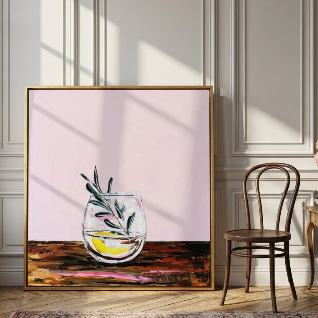 Oversized statement canvas wall art with a gold leaf surround leaning against the wall in a Parisian dining room