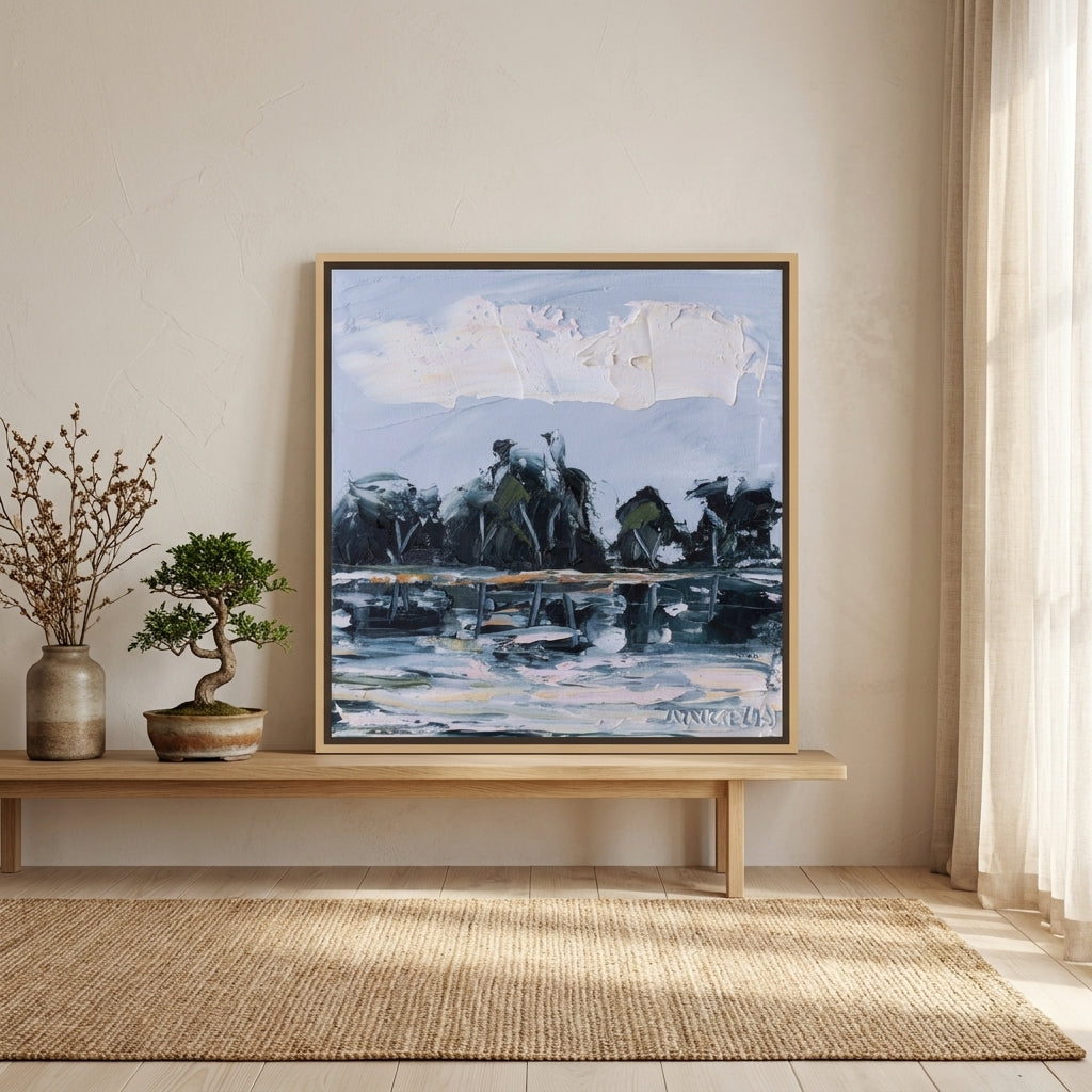 Canvas wall art with a natural timber surround standing on a bench in a warm Japandi bedroom