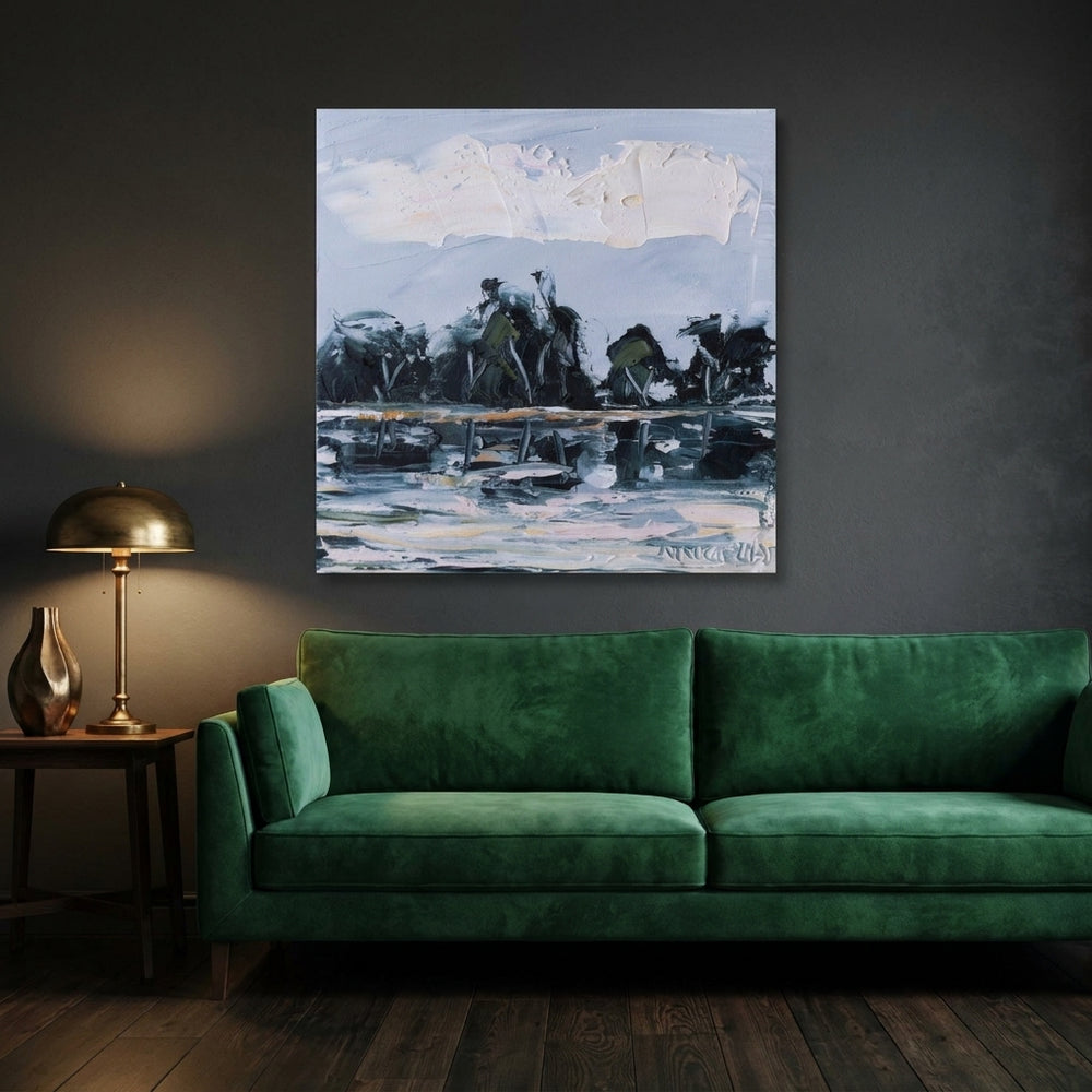 Stretched canvas wall art styled on the wall in a moody living room