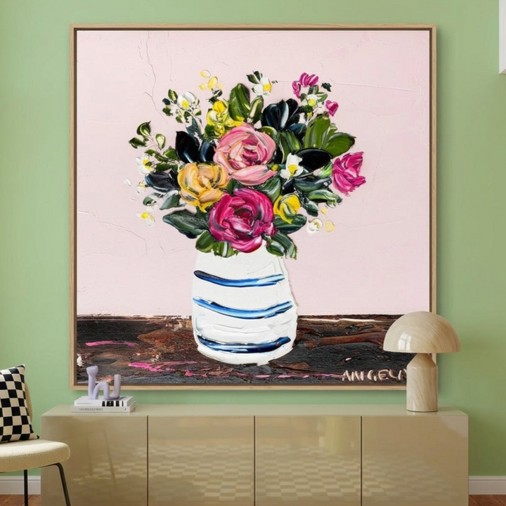 Oversized statement canvas wall art with a natural timber surround styled on the wall in a colourful eclectic living room
