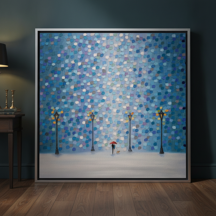 Oversized statement canvas wall art with a silver leaf surround leaning against the wall in a moody living room