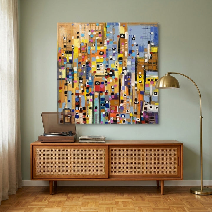 Stretched canvas wall art styled on the wall in a mid-century living room