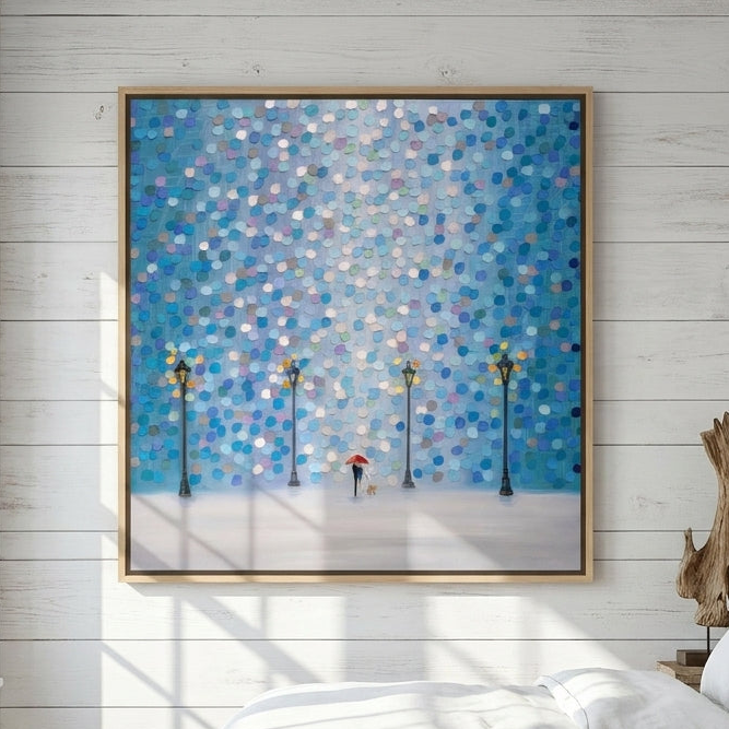 Canvas wall art with a natural timber surround styled on the wall in a coastal bedroom
