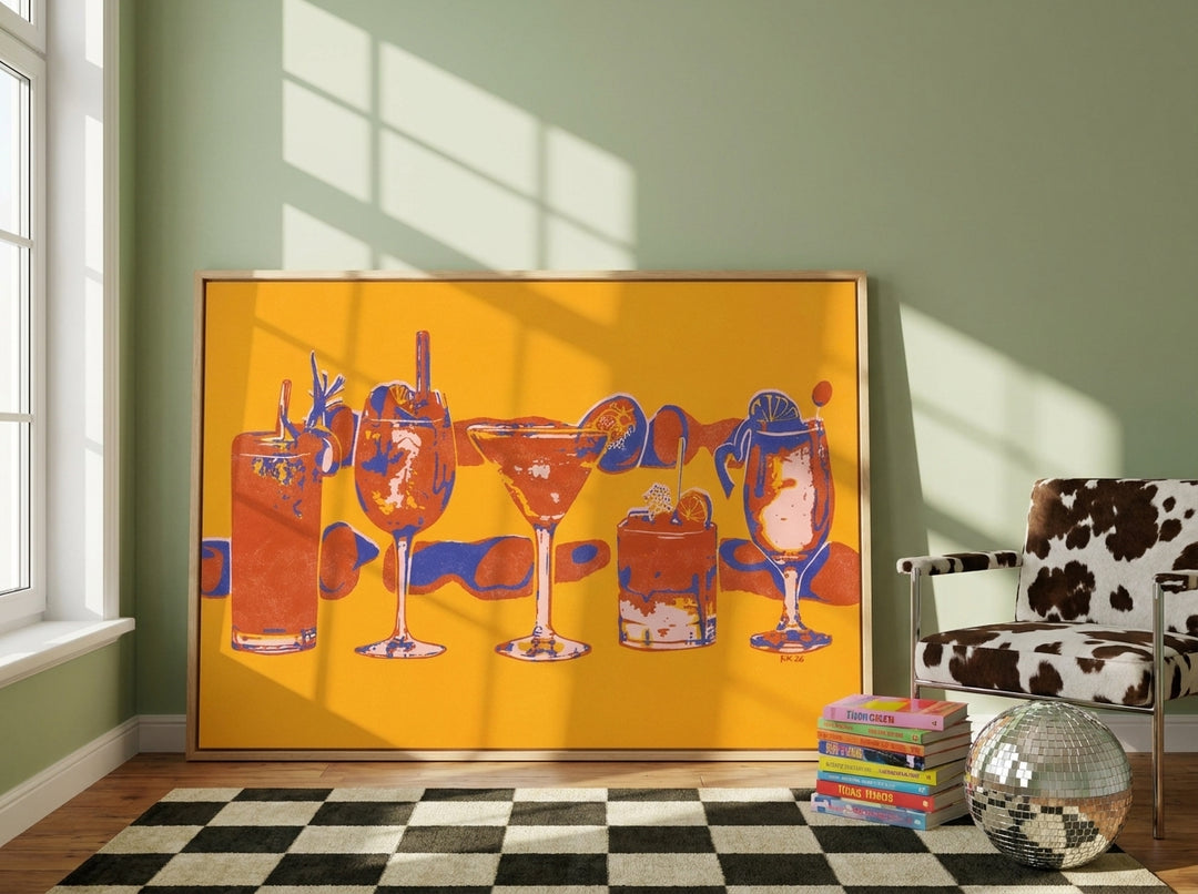 Oversized statement canvas wall art with a natural timber surround leaning against the wall in a colourful eclectic living room